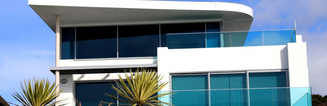 luxury condo with palm trees in front